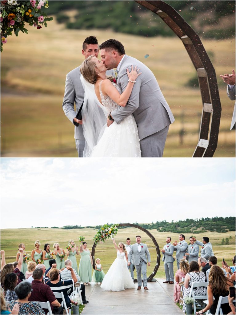 Guests throw confetti while bride and groom kiss at the end of their wedding ceremony